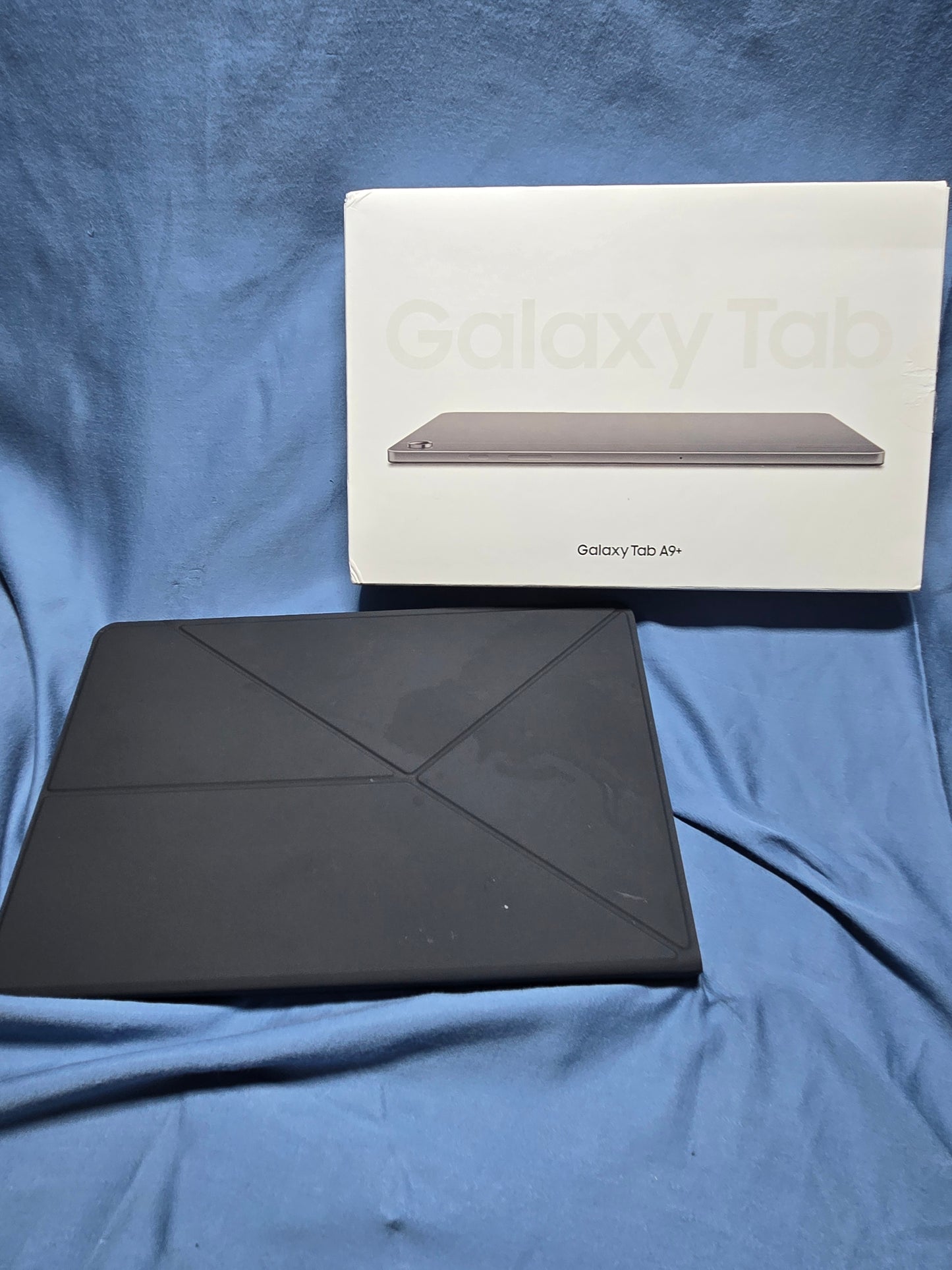 Samsung Galaxy Tab A9+ with book cover
