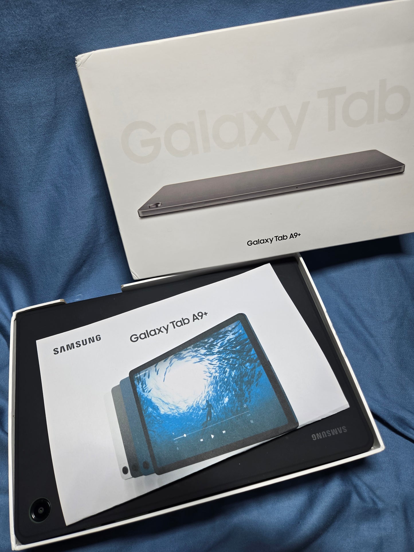 Samsung Galaxy Tab A9+ with book cover