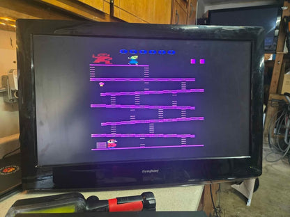 Atari 2600 with controllers and lots of favorite games